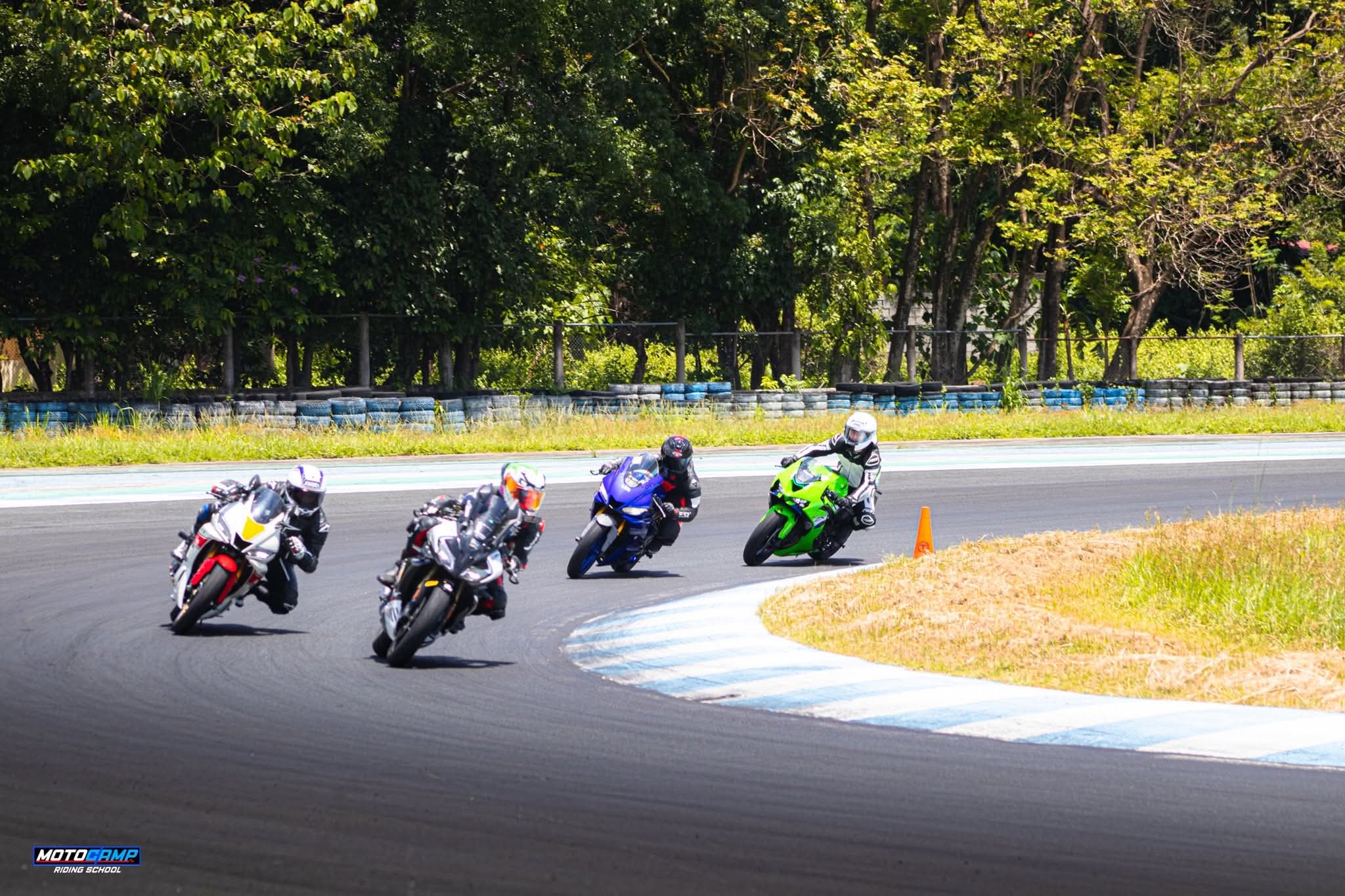 A pack of sport bikes on a circuit